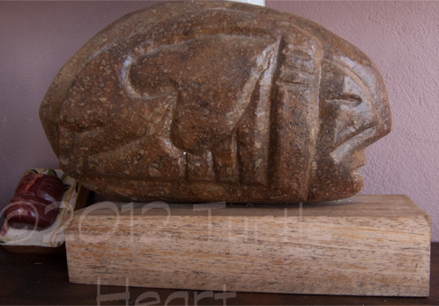 Red volcanic stone Pantelleria. Island Romance stone carving by Turtle Heart. Ojibwe.